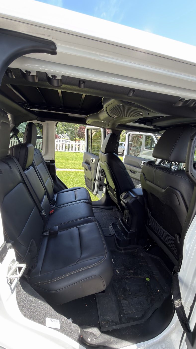 Jeep Wrangler rear cabin before detailing — debris on floor mats